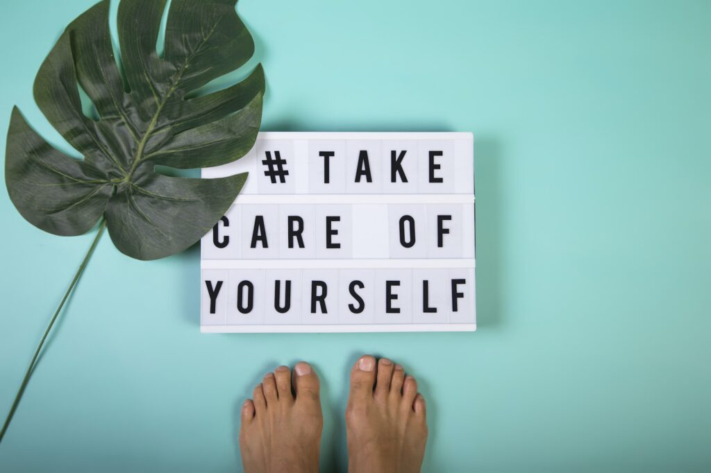 Message in a light box for self-care, mental health, emotional well-being. Top view.