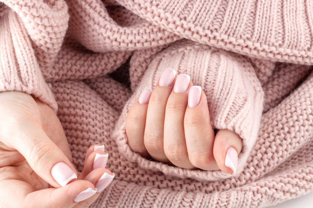 Fingernails with trendy french manicure.
