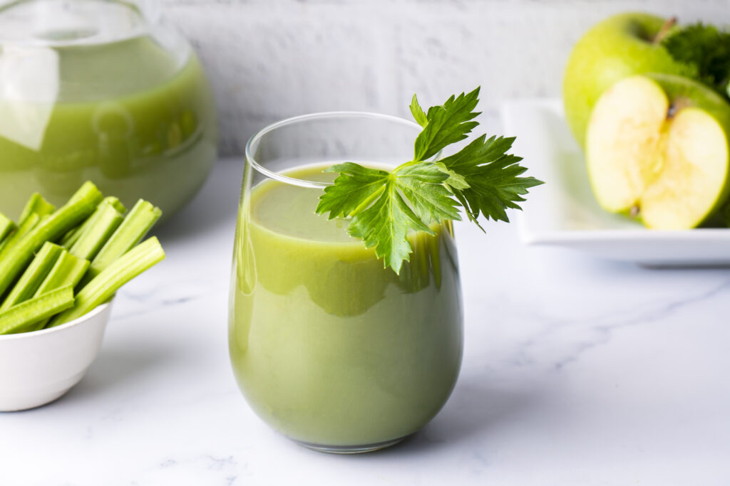A glass of green celery juice. Celery drink prepared for healthy nutrition and detox.