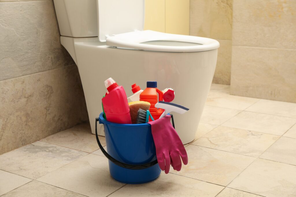 Bucket with cleaning products in modern bathroom 20-minute daily cleaning routine