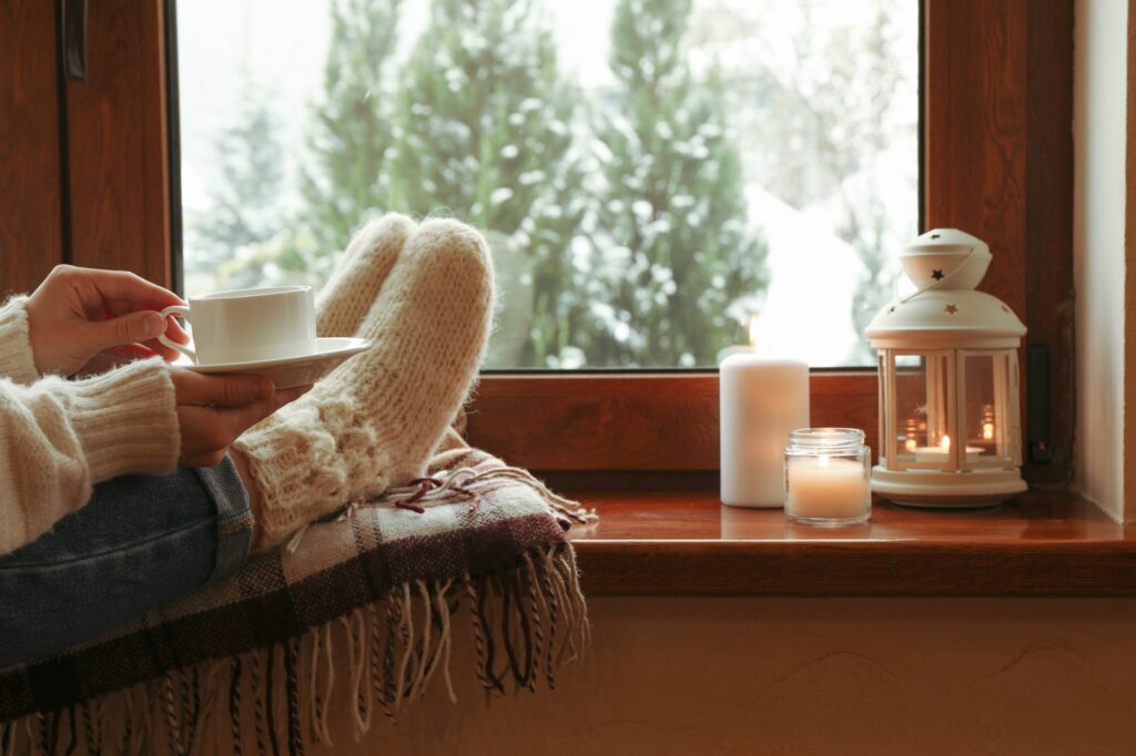 Composition of cozy winter day on wooden windowsill Coping With the Winter Blues