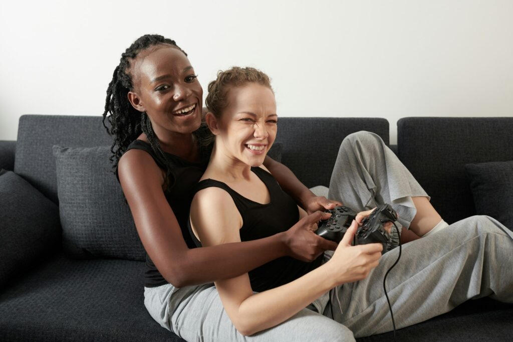 Hugging Couple Playing Videogame At-Home Date Night Ideas for Couples