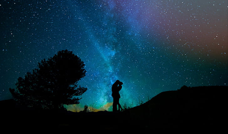 At-Home Date Night Ideas for Couples couple kissing under the stars